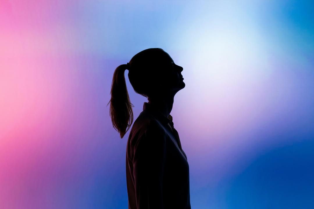 Silhouette of a person with gradient background